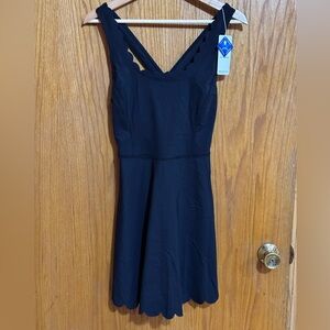 Attaco NWT women’s‎ athletic romper black scalloped edges sz medium